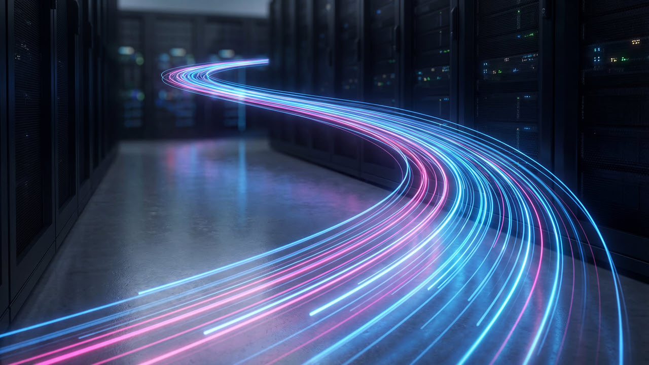 Blue and pink light trails curve through a dark data center corridor lined with server racks.